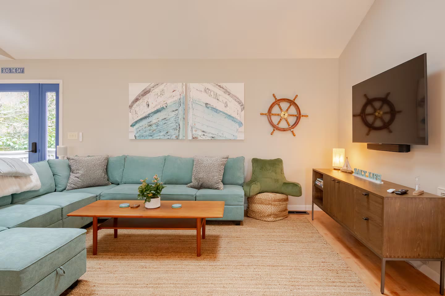Television wall and ship's wheel