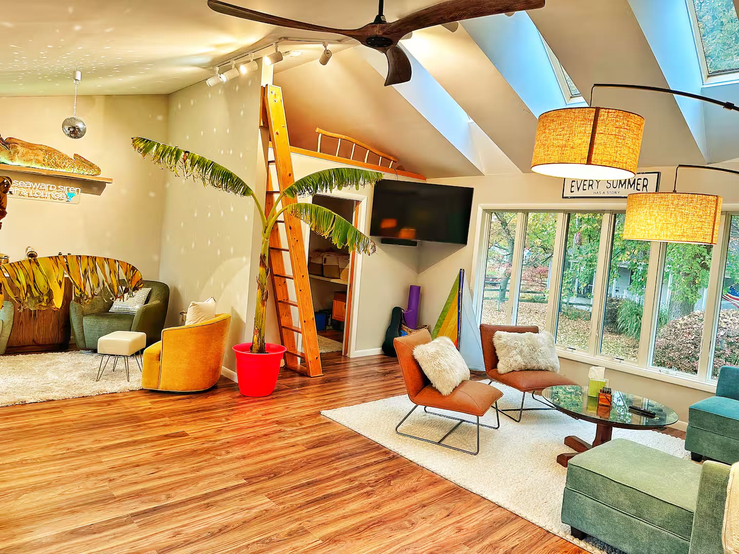 Open living room, loft ladder, and lounge