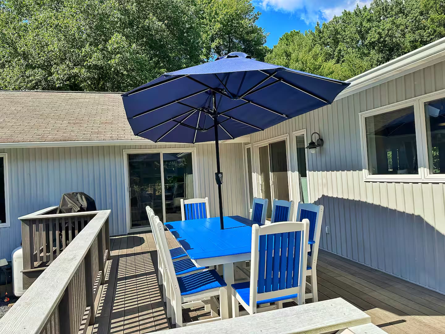 Deck dining table and umbrella